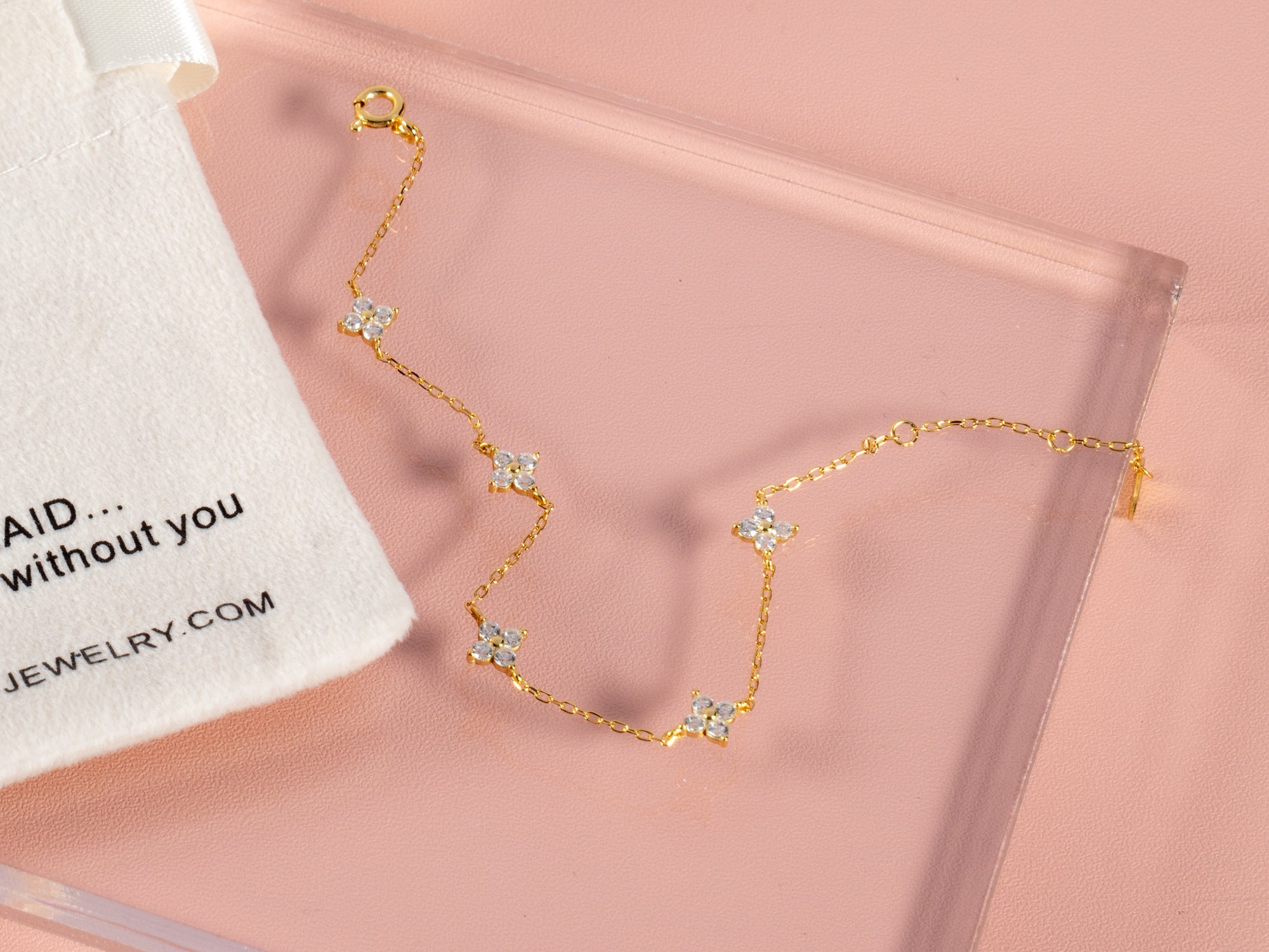 our crystal clover glower gemstone bracelet is adjustable and shown here with a congrats card for the bride making it a great gift for brides for showers or the wedding