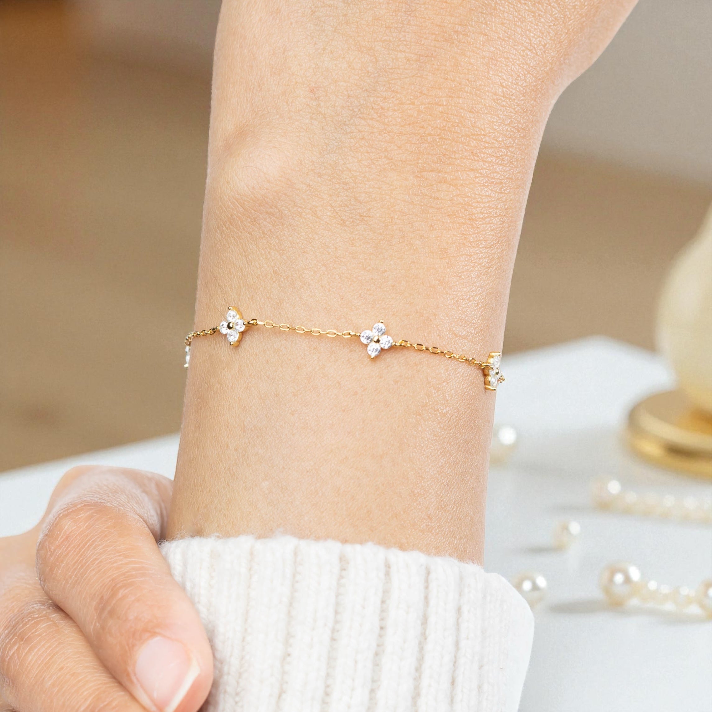 our crystal clover flower bracelet is shown here on a wrist and can be given as a bride gift