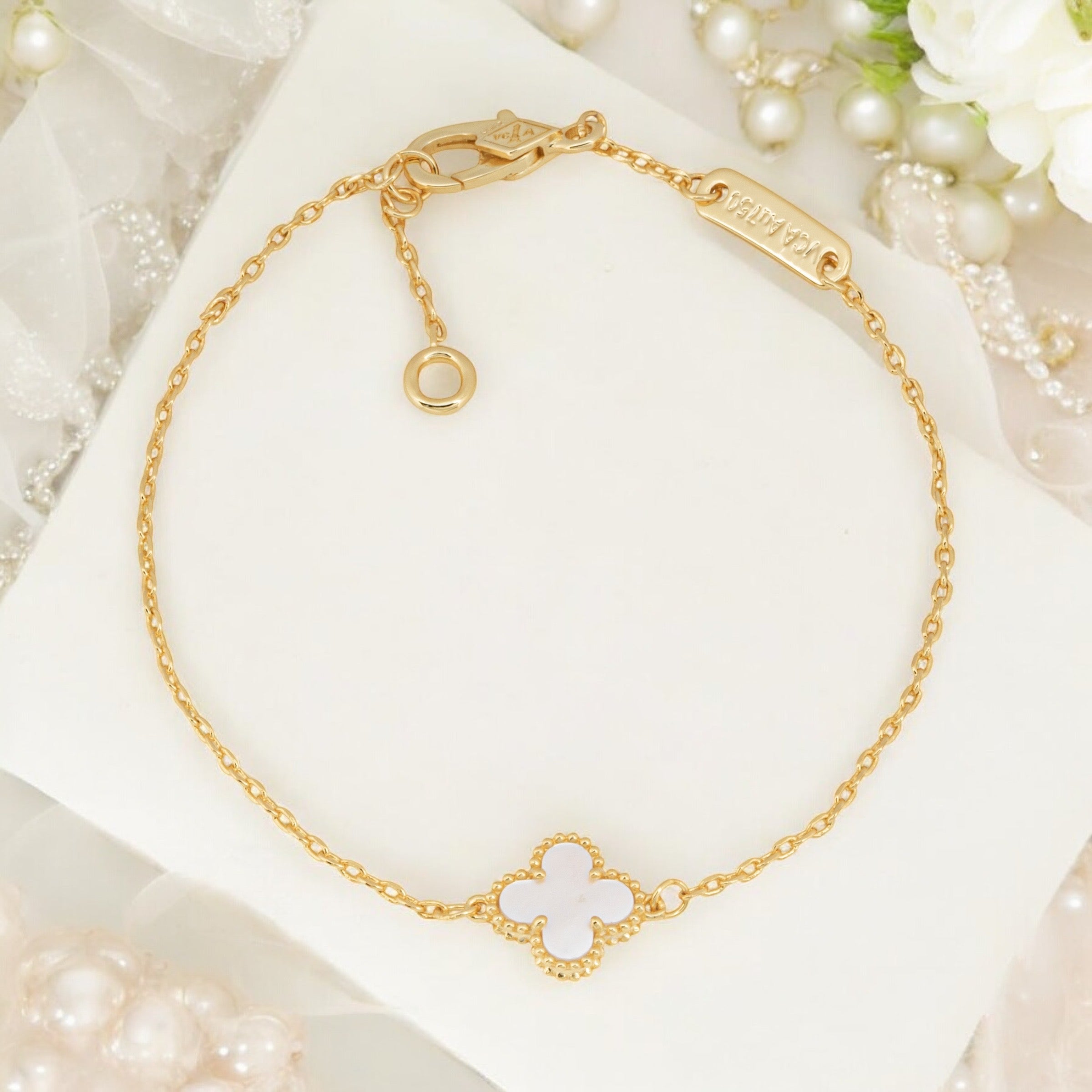 gold and white four leaf clover charm bracelet to be given as a bridesmaid gift bracelet