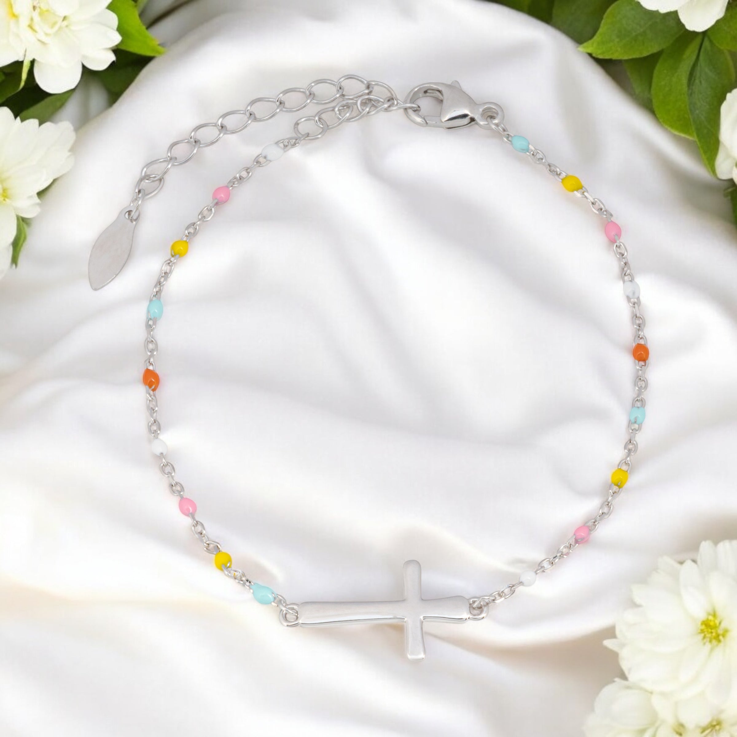 silver bridesmaid gift bracelet that is a cross for the christian bride
